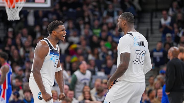Nov 27, 2024; Minneapolis, Minnesota, USA; Minnesota Timberwolves guard Anthony Edwards (5) and forward Julius Randle (30) celebrate against the Sacramento Kings in the fourth quarter at Target Center. Mandatory Credit: Brad Rempel-Imagn Images