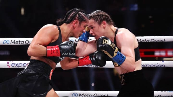 ARLINGTON, TEXAS - NOVEMBER 15: (L-R) Katie Taylor and Amanda Serrano fight during LIVE On Netflix: Taylor is likely to relinquish one of her belts after scorecard change ARLINGTON, TEXAS - NOVEMBER 15: (L-R) Katie Taylor and Amanda Serrano fight during LIVE On Netflix: Taylor is likely to relinquish one of her belts after scorecard change