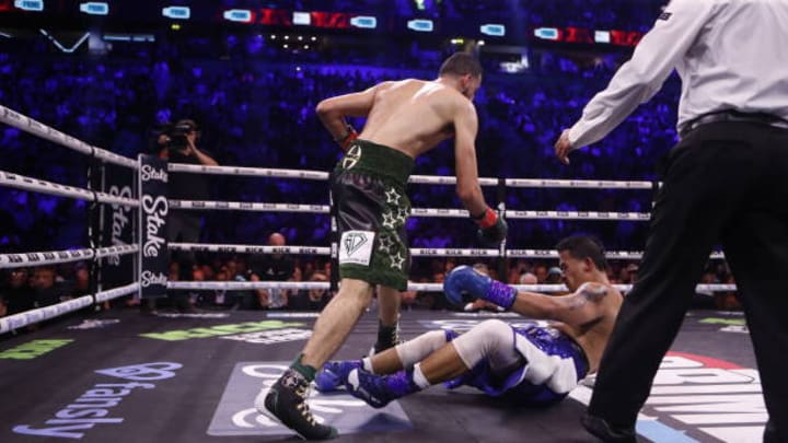 Slim knocks down Salt Papi during their middleweight bout 