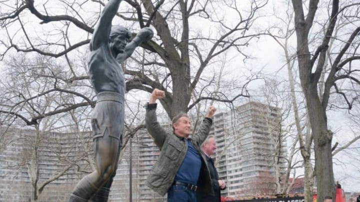 Sylvester Stallone, accompanied by Philadelphia Mayor Jim Kenney, raise his fists at the Rocky statue in Philadelphia, PA, on April 6, 2018. RockyFest honors the legacy of Rocky Balboa