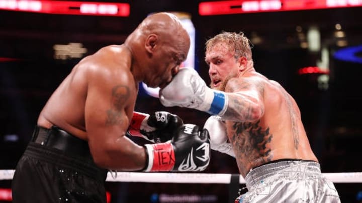 (L-R) Mike Tyson and Jake Paul fight during LIVE On Netflix: Jake Paul vs. Mike Tyson at AT&T Stadium on November 15, 2024 in Arlington, Texas. Mike’s professional standing suffers a blow after being thrashed by Jake Paul (L-R) Mike Tyson and Jake Paul fight during LIVE On Netflix: Jake Paul vs. Mike Tyson at AT&T Stadium on November 15, 2024 in Arlington, Texas. Mike’s professional standing suffers a blow after being thrashed by Jake Paul