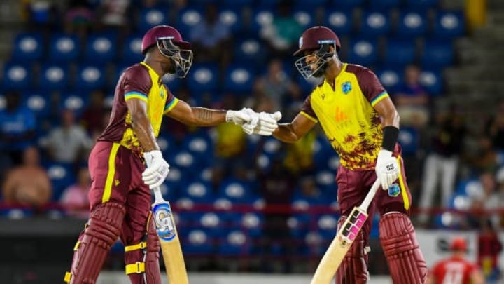 Evin Lewis (L) and Shai Hope (R) celebrate their 100-run partnership during the 4th T20I cricket match between England and West Indies on November 16, 2024. The pair staged a 136-run partnership off just 55 balls Evin Lewis (L) and Shai Hope (R) celebrate their 100-run partnership during the 4th T20I cricket match between England and West Indies on November 16, 2024. The pair staged a 136-run partnership off just 55 balls
