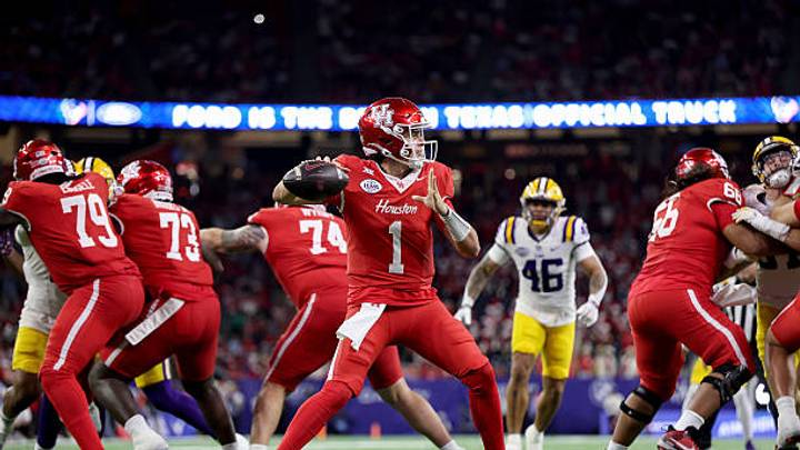 QB Conner Weigman throws a pass in the first half against LSU in Houston's 38-35 win at the Kinder Texas Bowl. (Photo by Tim Warner/Getty Images QB Conner Weigman throws a pass in the first half against LSU in Houston's 38-35 win at the Kinder Texas Bowl. (Photo by Tim Warner/Getty Images