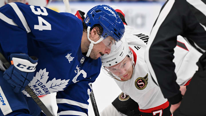 Apr 22, 2025; Toronto, Ontario, CAN;  Toronto Maple Leafs forward Auston Matthews (34) and Ottawa Senators forward Brady Tkachuk (7) line up for a face off in the second period in game two of the first round of the 2025 Stanley Cup Playoffs at Scotiabank Arena. Mandatory Credit: Dan Hamilton-Imagn Images