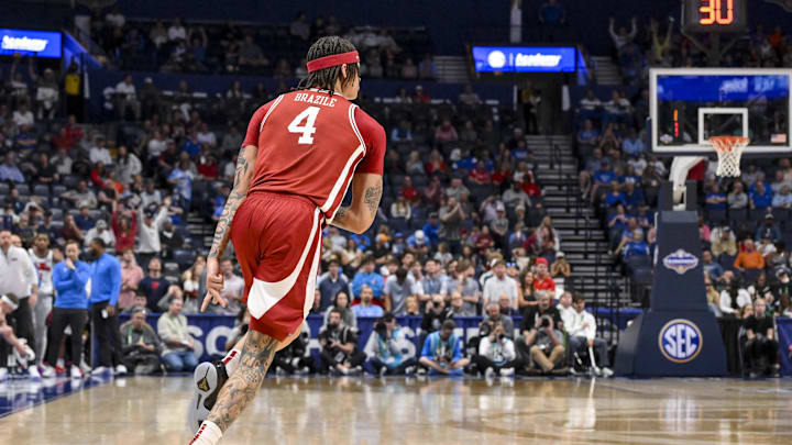 Mar 13, 2025; Nashville, TN, USA;  Arkansas Razorbacks forward Trevon Brazile (4) reacts after a made three point basket  against the Mississippi Rebel during the second half at Bridgestone Arena. Mandatory Credit: Steve Roberts-Imagn Images