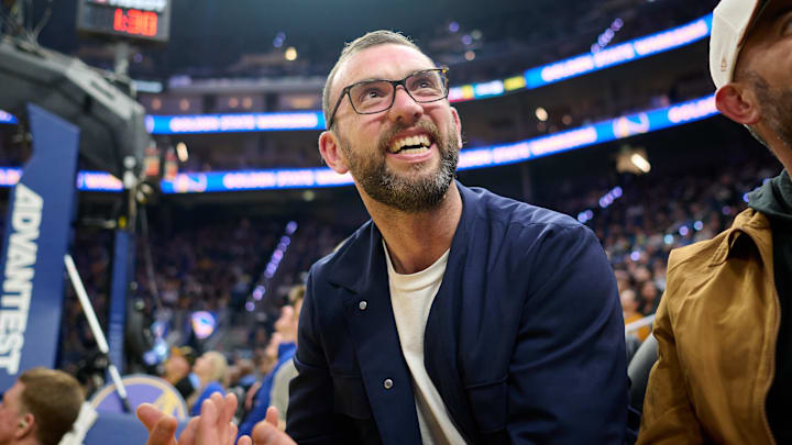 Dec 12, 2025; San Francisco, California, USA; General manager of the Stanford Cardinal football program Andrew Luck looks on during the first quarter of the game between the Golden State Warriors and the Minnesota Timberwolves at Chase Center. Mandatory Credit: Robert Edwards-Imagn Images