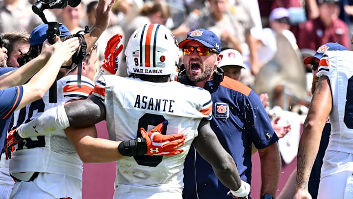 Sep 23, 2023; College Station, Texas, USA; Auburn Tigers linebacker coach Josh Aldridge reacts after linebacker Eugene Asante (9) touch down during the third quarter against the Texas A&M Aggies at Kyle Field. Mandatory Credit: Maria Lysaker-USA TODAY Sports
