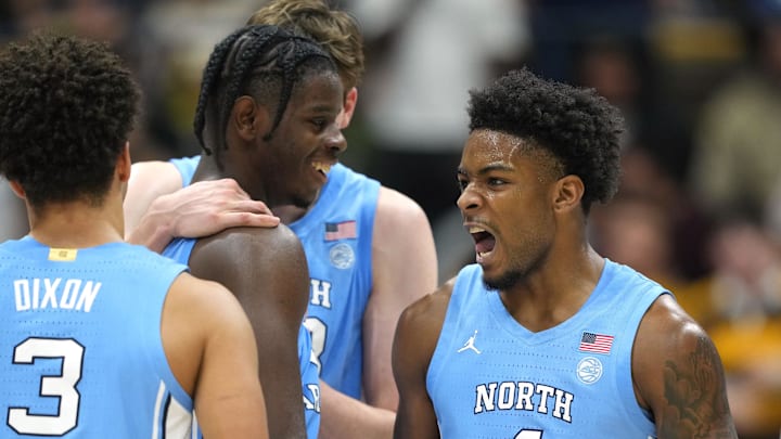 Jan 17, 2026; Berkeley, California, USA; North Carolina Tar Heels guard Jaydon Young (4) celebrates with guard Derek Dixon (3) during the second half against the California Golden Bears at Haas Pavilion. Mandatory Credit: Darren Yamashita-Imagn Images