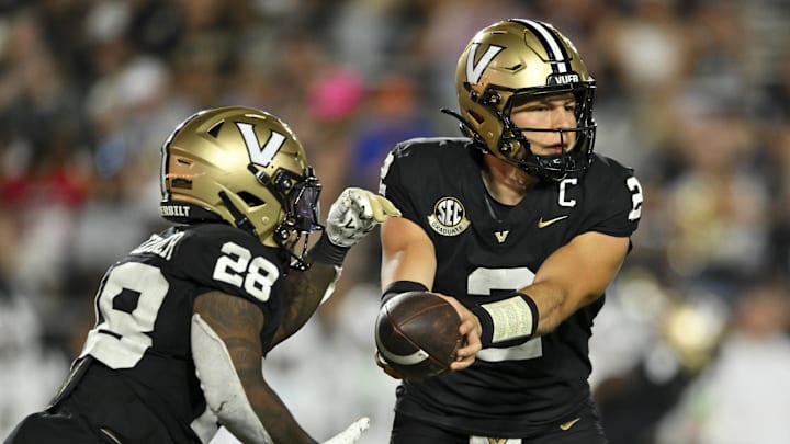 Aug 30, 2025; Nashville, Tennessee, USA;  Vanderbilt Commodores quarterback Diego Pavia (2) hands the ball off to  running back Sedrick Alexander (28) against the Charleston Southern Buccaneers during the second half at FirstBank Stadium. Mandatory Credit: Steve Roberts-Imagn Images