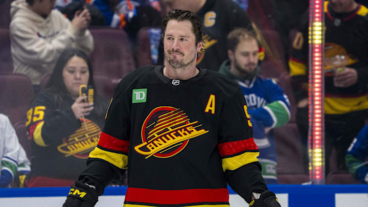 Jan 18, 2025; Vancouver, British Columbia, CAN; Vancouver Canucks forward J.T. Miller (9) smiles during warm up prior to a game against the Edmonton Oilers at Rogers Arena. Mandatory Credit: Bob Frid-Imagn Images