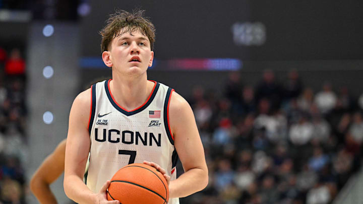 Oct 28, 2025; Hartford, CT, USA; Connecticut Huskies guard Jacob Furphy (7) shoots a free throw during the first half against the Michigan State Spartans at PeoplesBank Arena.