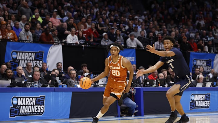 Mar 19, 2025; Dayton, OH, USA; Texas Longhorns guard Tre Johnson (20) dribbles pressured by Xavier Musketeers guard Dailyn Swain (3) in the first half at UD Arena. Mandatory Credit: Rick Osentoski-Imagn Images