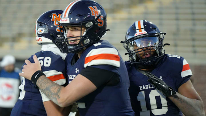 Nashville Christian's Jared Curtis (2), Clay Klotz (58), and Terry Ward (10) celebrate after Curtis' touchdown against Columbia Academy in the TSSAA Division II-A Bluecross Bowl on Thursday, Dec. 5, 2024, in Chattanooga, Tenn.