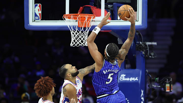 Oct 10, 2025; Philadelphia, Pennsylvania, USA; Orlando Magic forward Paolo Banchero (5) drives for a shot against Philadelphia 76ers forward Johni Broome (22) during the second quarter at Xfinity Mobile Arena. Mandatory Credit: Bill Streicher-Imagn Images Oct 10, 2025; Philadelphia, Pennsylvania, USA; Orlando Magic forward Paolo Banchero (5) drives for a shot against Philadelphia 76ers forward Johni Broome (22) during the second quarter at Xfinity Mobile Arena. Mandatory Credit: Bill Streicher-Imagn Images