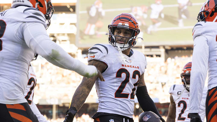 Oct 20, 2024; Cleveland, Ohio, USA; Cincinnati Bengals safety Geno Stone (22) and teammates celebrate his interception during the fourth quarter against the Cleveland Browns at Huntington Bank Field. Mandatory Credit: Scott Galvin-Imagn Images Oct 20, 2024; Cleveland, Ohio, USA; Cincinnati Bengals safety Geno Stone (22) and teammates celebrate his interception during the fourth quarter against the Cleveland Browns at Huntington Bank Field. Mandatory Credit: Scott Galvin-Imagn Images