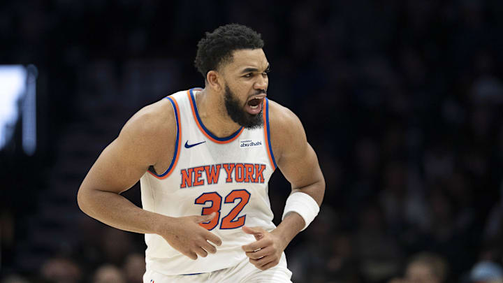 Dec 23, 2025; Minneapolis, Minnesota, USA; New York Knicks center Karl-Anthony Towns (32) celebrates making a three point shot against the Minnesota Timberwolves in the second half at Target Center. Mandatory Credit: Jesse Johnson-Imagn Images