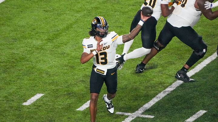 Sep 11, 2026; Lawrence, Kansas, USA; Missouri Tigers quarterback Austin Simmons (13) throws a pass against the Kansas Jayhawks during the first half of the game at David Booth Kansas Memorial Stadium. Mandatory Credit: Denny Medley-Imagn Images
