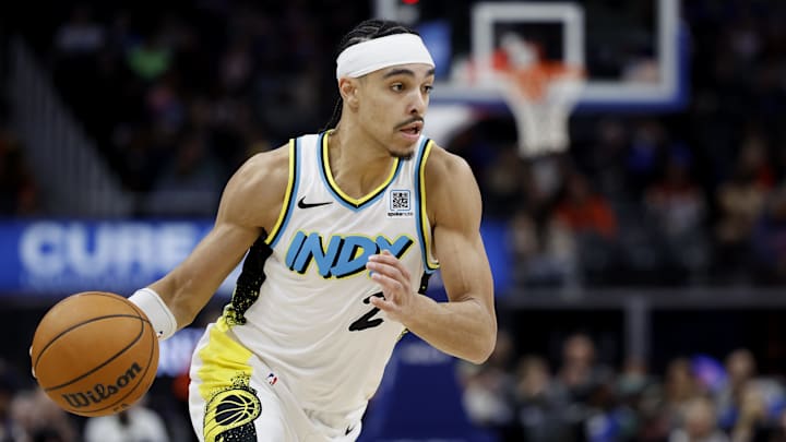 Jan 16, 2025; Detroit, Michigan, USA;  Indiana Pacers guard Andrew Nembhard (2) dribbles in the second half against the Detroit Pistons at Little Caesars Arena. Mandatory Credit: Rick Osentoski-Imagn Images