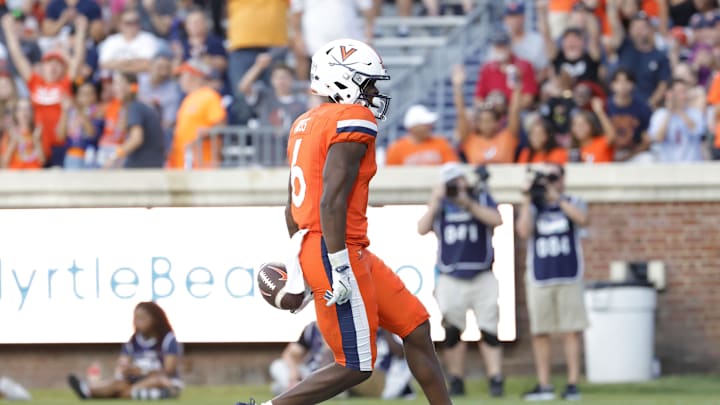 Aug 30, 2025; Charlottesville, Virginia, USA; Virginia Cavaliers wide receiver Cam Ross (6) scores a touchdown against the Coastal Carolina Chanticleers during the second quarter at Scott Stadium. Mandatory Credit: Amber Searls-Imagn Images