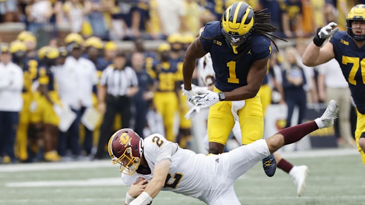 Sep 13, 2025; Ann Arbor, Michigan, USA;  Central Michigan Chippewas quarterback Joe Labas (2)  is sacked by Michigan Wolverines linebacker Jaishawn Barham (1) in the first half at Michigan Stadium. Mandatory Credit: Rick Osentoski-Imagn Images