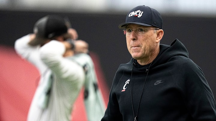 Cincinnati Bearcats head coach Scott Satterfield walks the field during football practice at Sheakley Athletic Performance Center in Cincinnati on Dec. 18, 2025.