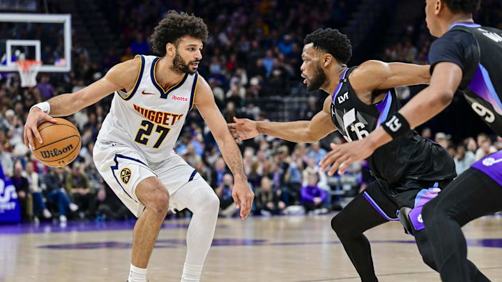 Mar 2, 2026; Salt Lake City, Utah, USA; Denver Nuggets guard Jamal Murray (27) plans his next shot over Utah Jazz guard Elijah Harkless (16) during the second half at Delta Center. Mandatory Credit: Peter Creveling-Imagn Images