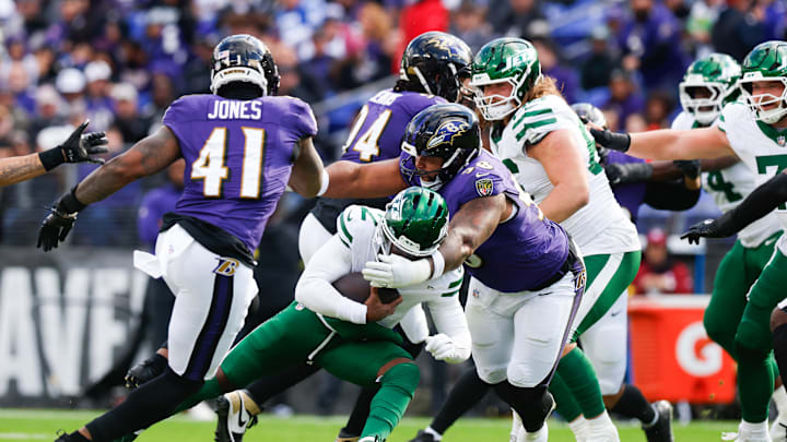 Nov 23, 2025; Baltimore, Maryland, USA; New York Jets quarterback Tyrod Taylor (2) is tackled by Baltimore Ravens defensive tackle Travis Jones (98) during the second quarter at M&T Bank Stadium. Mandatory Credit: Peter Casey-Imagn Images Nov 23, 2025; Baltimore, Maryland, USA; New York Jets quarterback Tyrod Taylor (2) is tackled by Baltimore Ravens defensive tackle Travis Jones (98) during the second quarter at M&T Bank Stadium. Mandatory Credit: Peter Casey-Imagn Images