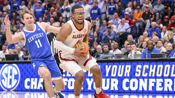 Mar 14, 2025; Nashville, TN, USA; Alabama Crimson Tide guard Chris Youngblood (8) drives to the basket against the Kentucky Wildcats during the first half at Bridgestone Arena. Mandatory Credit: Steve Roberts-Imagn Images Mar 14, 2025; Nashville, TN, USA; Alabama Crimson Tide guard Chris Youngblood (8) drives to the basket against the Kentucky Wildcats during the first half at Bridgestone Arena. Mandatory Credit: Steve Roberts-Imagn Images
