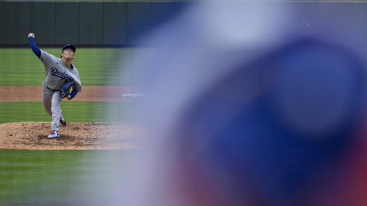 Dodgers starting pitcher Yoshinobu Yamamoto (18) pitches against the St. Louis Cardinals during the sixth inning at Busch Stadium on June 7.