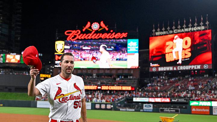 Sep 18, 2023; St. Louis, Missouri, USA; St. Louis Cardinals starting pitcher Adam Wainwright (50) tips his cap to the fans as he receives a standing ovation after winning his 200th career game in a 1-0 victory over the Milwaukee Brewers at Busch Stadium. Mandatory Credit: Jeff Curry-USA TODAY Sports Sep 18, 2023; St. Louis, Missouri, USA; St. Louis Cardinals starting pitcher Adam Wainwright (50) tips his cap to the fans as he receives a standing ovation after winning his 200th career game in a 1-0 victory over the Milwaukee Brewers at Busch Stadium. Mandatory Credit: Jeff Curry-USA TODAY Sports