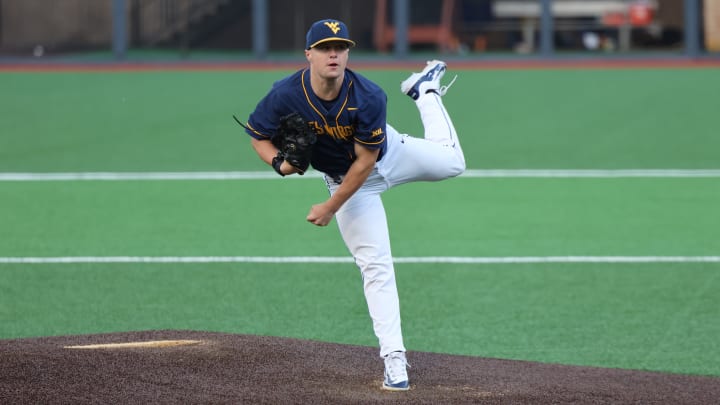 West Virginia senior starting pitcher Derek Clark hurls a pitch against Kansas State