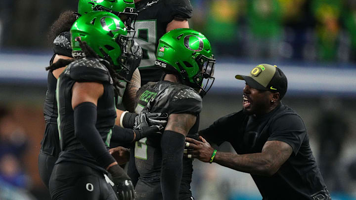 Oregon Ducks defensive back Nikko Reed (9) celebrates an interception Sunday, Dec. 8, 2024, during the Big Ten Championship game at Lucas Oil Stadium in Indianapolis. The Oregon Ducks defeated the Penn State Nittany Lions, 45-37.