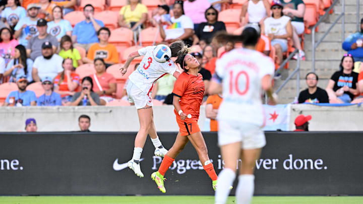 Jul 16, 2022; Houston, Texas, USA;  Houston Dash forward Maria Sanchez (7) and Chicago Red Stars Arin Wright battle for a 50-50 ball.