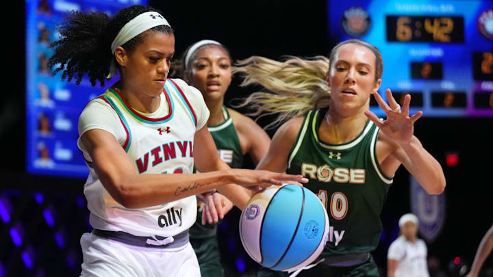 Jan 17, 2025; Miami, FL, USA; Rae Burrell (12) of the Vinyl battles for possession with Lexie Hull (10) and Angel Reese (5) of the Rose in the first half of the Unrivaled women’s professional 3v3 basketball league at Wayfair Arena. Mandatory Credit: Jim Rassol-Imagn Images Jan 17, 2025; Miami, FL, USA; Rae Burrell (12) of the Vinyl battles for possession with Lexie Hull (10) and Angel Reese (5) of the Rose in the first half of the Unrivaled women’s professional 3v3 basketball league at Wayfair Arena. Mandatory Credit: Jim Rassol-Imagn Images