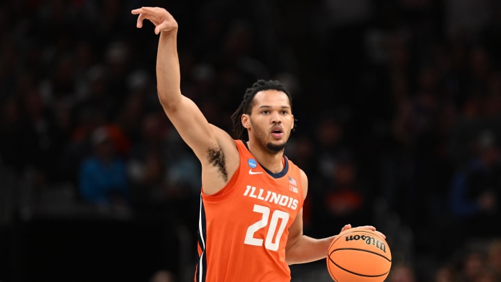 Mar 30, 2024; Boston, MA, USA; Illinois Fighting Illini forward Ty Rodgers (20) dribbles the ball against the Connecticut Huskies in the finals of the East Regional of the 2024 NCAA Tournament at TD Garden. Mandatory Credit: Brian Fluharty-USA TODAY Sports