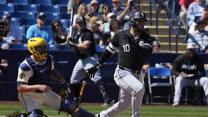 Chicago White Sox third baseman Yoan Moncada (10) hits against the Milwaukee Brewers in the first inning at American Family Fields of Phoenix on March 13, 2024.