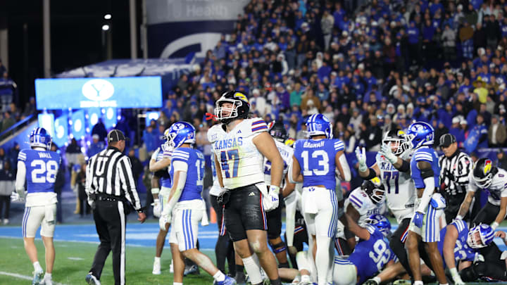 Nov 16, 2024; Provo, Utah, USA; Kansas Jayhawks cornerback Jacoby Davis (47) celebrates a win over the Brigham Young Cougars after the last play of the fourth quarter at LaVell Edwards Stadium. Mandatory Credit: Rob Gray-Imagn Images Nov 16, 2024; Provo, Utah, USA; Kansas Jayhawks cornerback Jacoby Davis (47) celebrates a win over the Brigham Young Cougars after the last play of the fourth quarter at LaVell Edwards Stadium. Mandatory Credit: Rob Gray-Imagn Images