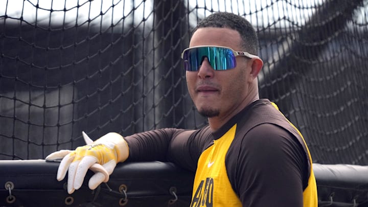 Feb 15, 2026; Peoria, AZ, USA; San Diego Padres third baseman Manny MacHado (13) gets ready to hit during spring training camp. Mandatory Credit: Rick Scuteri-Imagn Images