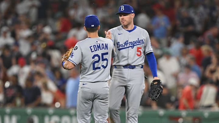 Jul 25, 2025; Boston, Massachusetts, USA; Los Angeles Dodgers first baseman Freddie Freeman (5) high-fives second baseman Tommy Edman (25) after a game against the Boston Red Sox at Fenway Park. Mandatory Credit: Brian Fluharty-Imagn Images Jul 25, 2025; Boston, Massachusetts, USA; Los Angeles Dodgers first baseman Freddie Freeman (5) high-fives second baseman Tommy Edman (25) after a game against the Boston Red Sox at Fenway Park. Mandatory Credit: Brian Fluharty-Imagn Images