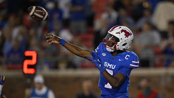 Nov 2, 2024; Dallas, Texas, USA; Southern Methodist Mustangs quarterback Kevin Jennings (7) throws the ball from his end zone during the second half against the Pittsburgh Panthers at Gerald J. Ford Stadium. Mandatory Credit: Jerome Miron-Imagn Images Nov 2, 2024; Dallas, Texas, USA; Southern Methodist Mustangs quarterback Kevin Jennings (7) throws the ball from his end zone during the second half against the Pittsburgh Panthers at Gerald J. Ford Stadium. Mandatory Credit: Jerome Miron-Imagn Images