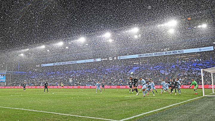 Mar 15, 2025; Kansas City, Kansas, USA;  Minnesota United midfielder Robin Lod (17) heads the ball against Sporting Kansas City forward Dejan Joveljic (9) in the first half at Children's Mercy Park. Mandatory Credit: Peter Aiken-Imagn Images