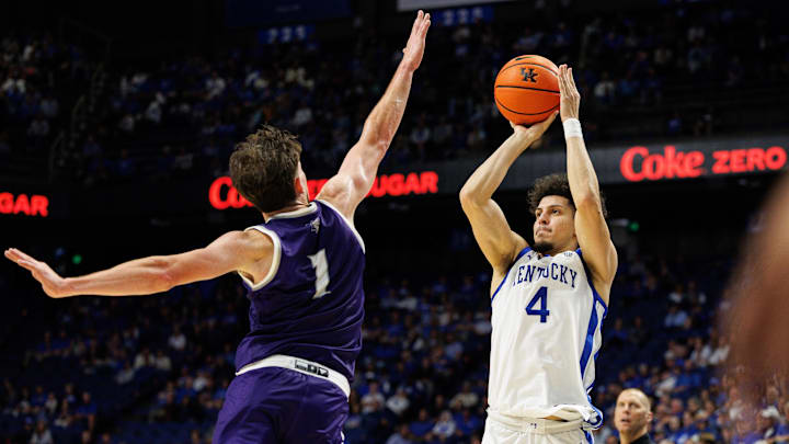 Oct 23, 2024; Lexington, KY, USA; Kentucky Wildcats guard Koby Brea (4) shoots the ball against Kentucky Wesleyan Panthers forward Alex Gray (1) during the second half at Rupp Arena at Central Bank Center. Mandatory Credit: Jordan Prather-Imagn Images
