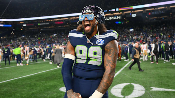 Jan 17, 2026; Seattle, WA, USA;  Seattle Seahawks defensive end Leonard Williams (99) celebrates on the field following an NFC Divisional Round game against the San Francisco 49ers at Lumen Field. Mandatory Credit: Steven Bisig-Imagn Images