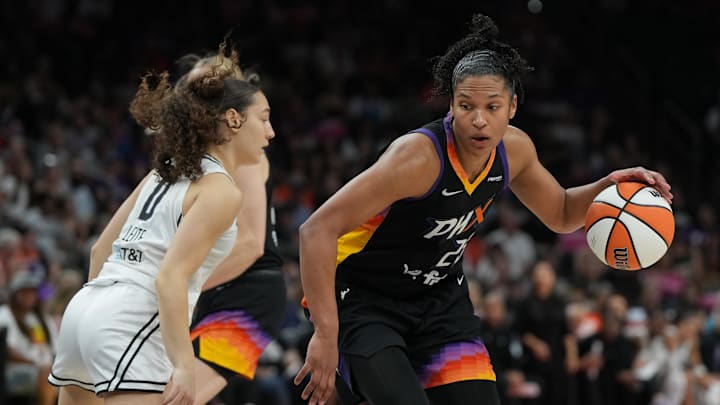 Aug 22, 2025; Phoenix, Arizona, USA; Phoenix Mercury forward Alyssa Thomas (25) drives on Golden State Valkyries guard Carla Leite (0) in the second half at Footprint Center. Mandatory Credit: Rick Scuteri-Imagn Images