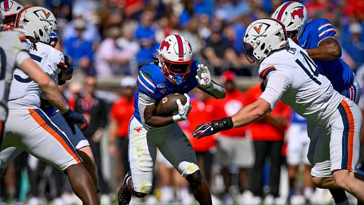 Oct 17, 2026; Dallas, Texas, USA; Virginia Cavaliers defensive end Fisher Camac (14) tackles SMU Mustangs running back Kendrick Raphael (6) during the first half at Gerald J. Ford Stadium. Mandatory Credit: Jerome Miron-Imagn Images Oct 17, 2026; Dallas, Texas, USA; Virginia Cavaliers defensive end Fisher Camac (14) tackles SMU Mustangs running back Kendrick Raphael (6) during the first half at Gerald J. Ford Stadium. Mandatory Credit: Jerome Miron-Imagn Images