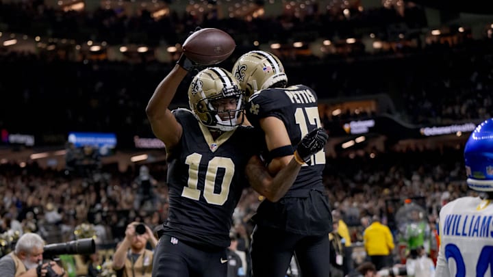 Dec 1, 2024; New Orleans, Louisiana, USA; New Orleans Saints wide receiver Marquez Valdes-Scantling (10) reacts with New Orleans Saints wide receiver Dante Pettis (17) after a touchdown against Los Angeles Rams cornerback Darious Williams (24) during the fourth quarter at Caesars Superdome. Mandatory Credit: Matthew Hinton-Imagn Images