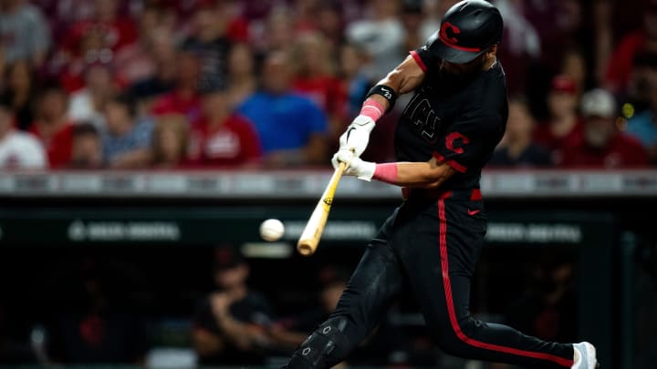 Cincinnati Reds outfielder Nick Martini (23) hits an RBI base hit in the ninth inning of the MLB game between the Cincinnati Reds and the Detroit Tigers at Great American Ball Park in Cincinnati on Friday, July 5, 2024.