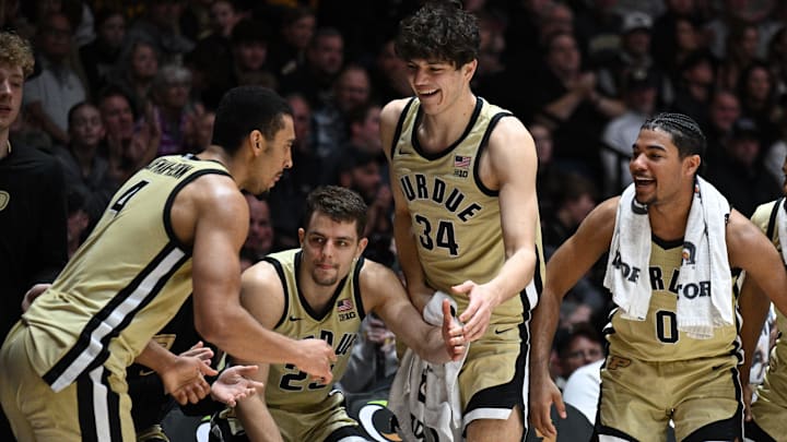 Purdue Boilermakers forward Trey Kaufman-Renn (4) celebrates a three-point basket with his teammates 