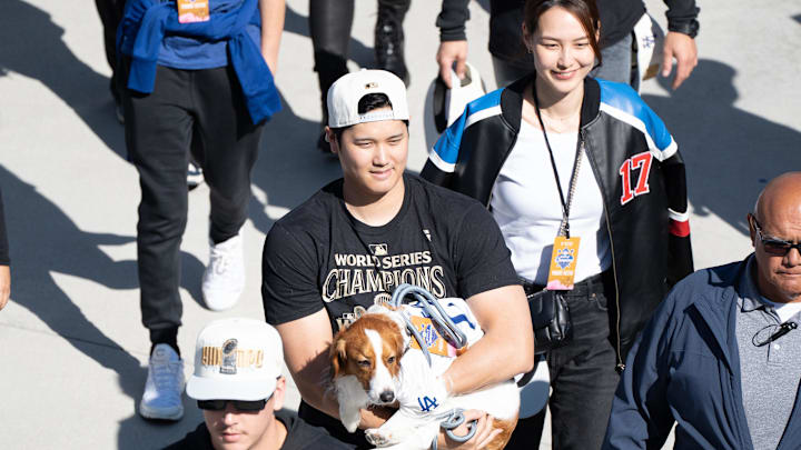 Nov 1, 2024; Los Angeles, CA, USA; Los Angeles Dodger Shohei Ohtani, wife Mamiko Tanaka and dog Decoy arrive at Dodger Stadium for the teamís World Series Championship celebration. Mandatory Credit: Sandy Hooper-USA TODAY via Imagn Images