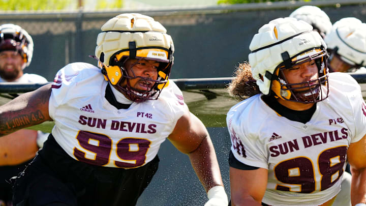 Arizona State defensive linemen CJ Fite (99) and Jacob Rich Kongaika (98) run a drill during the first day of fall practice in Tempe, Ariz. on July 30, 2025. Arizona State defensive linemen CJ Fite (99) and Jacob Rich Kongaika (98) run a drill during the first day of fall practice in Tempe, Ariz. on July 30, 2025.